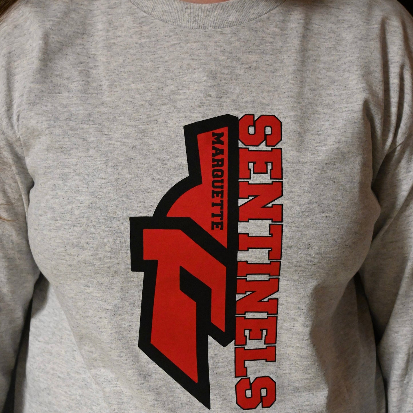 Half Sentinel helmet with "Sentinels" written vertically on light Grey Long Sleeve