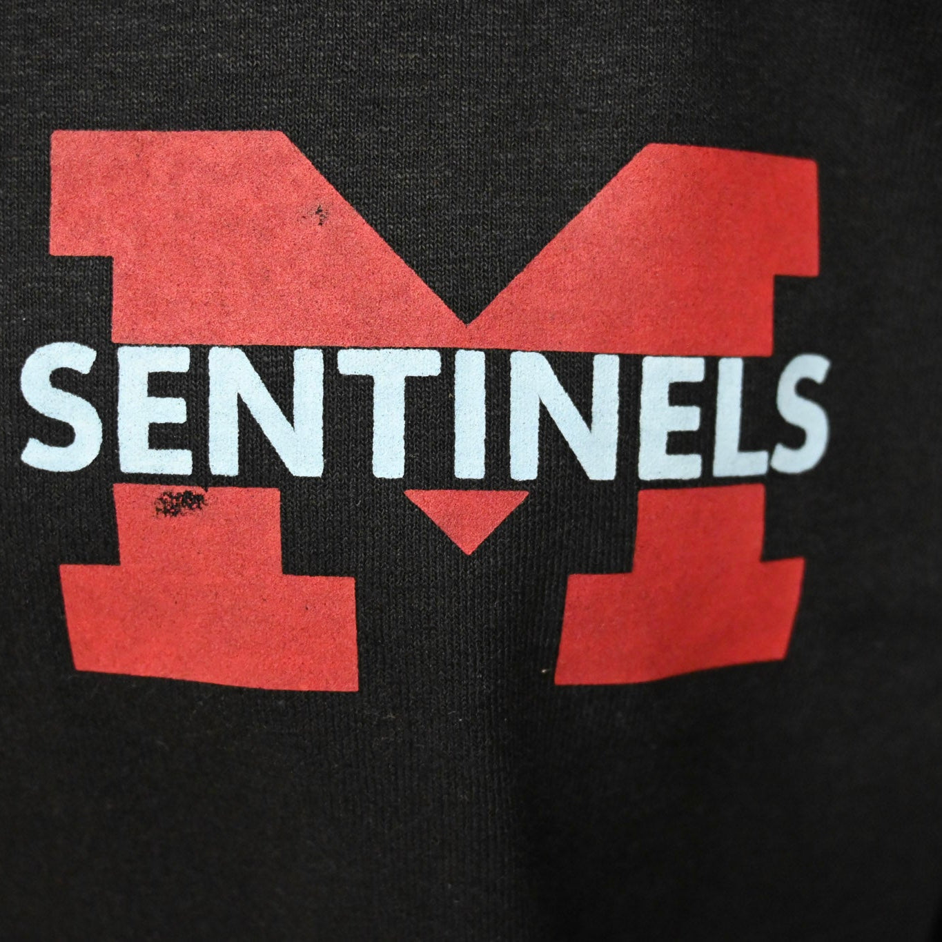 DISCOUNTED ITEM: BLACK LONG SLEEVE WITH POCKET SENTINELS "M" Design (slight damage on logo)