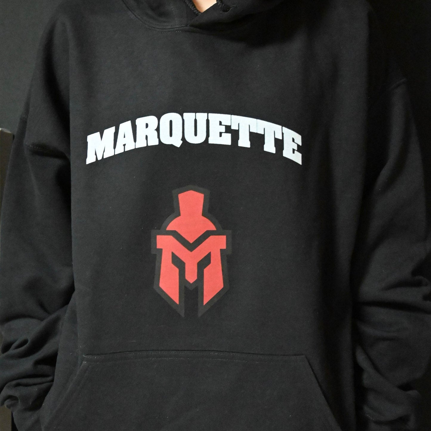 Black Heavy Weight Hoodie with Marquette text and medium sentinel head