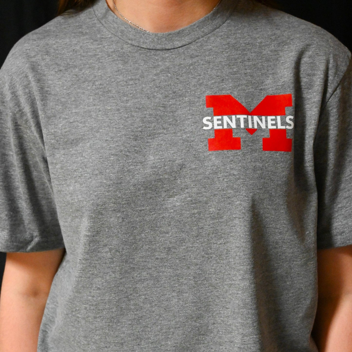 Sentinel "M" pocket design with "BE THERE BE LOUD GO RED" on back t-shirt