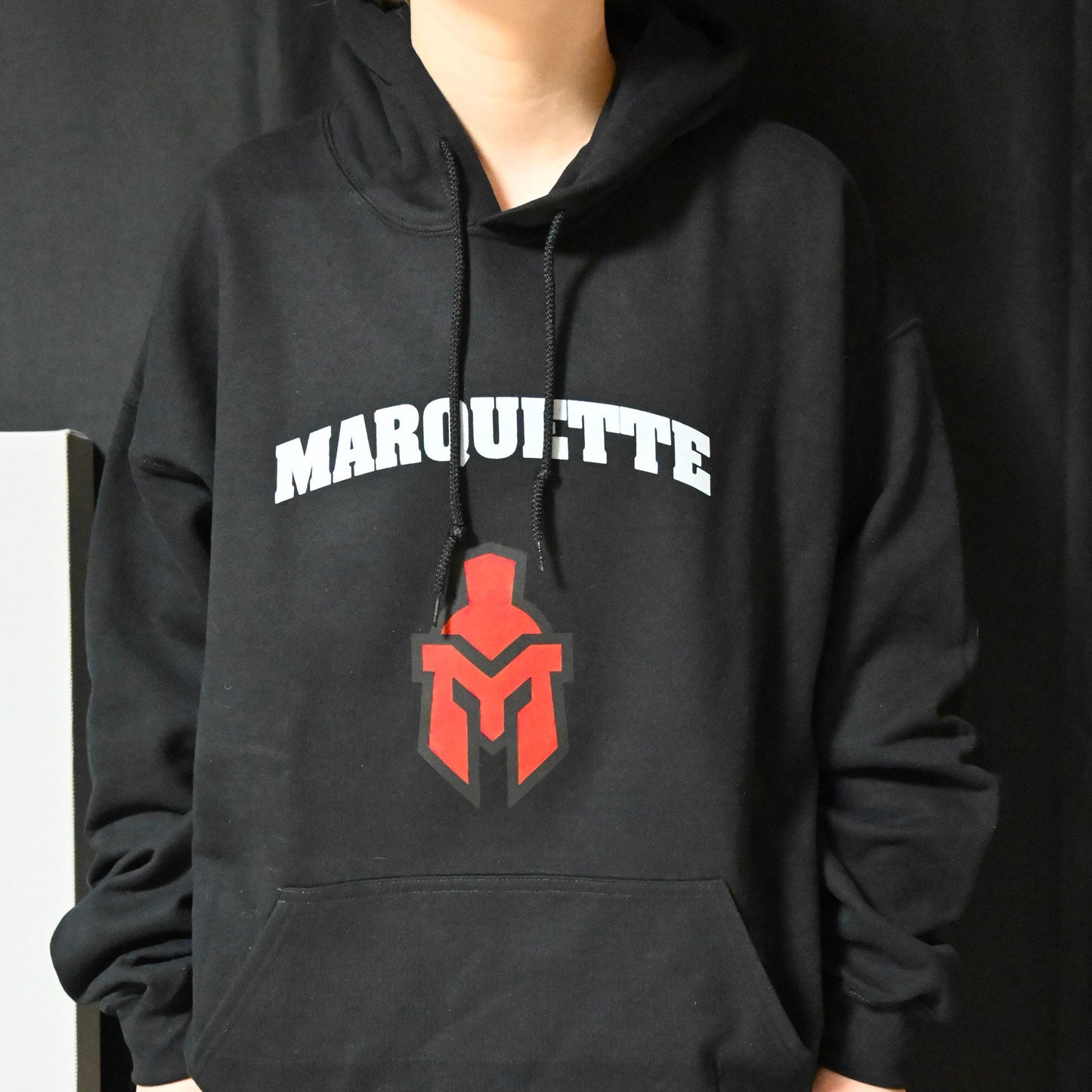 Black Heavy Weight Hoodie with Marquette text and medium sentinel head