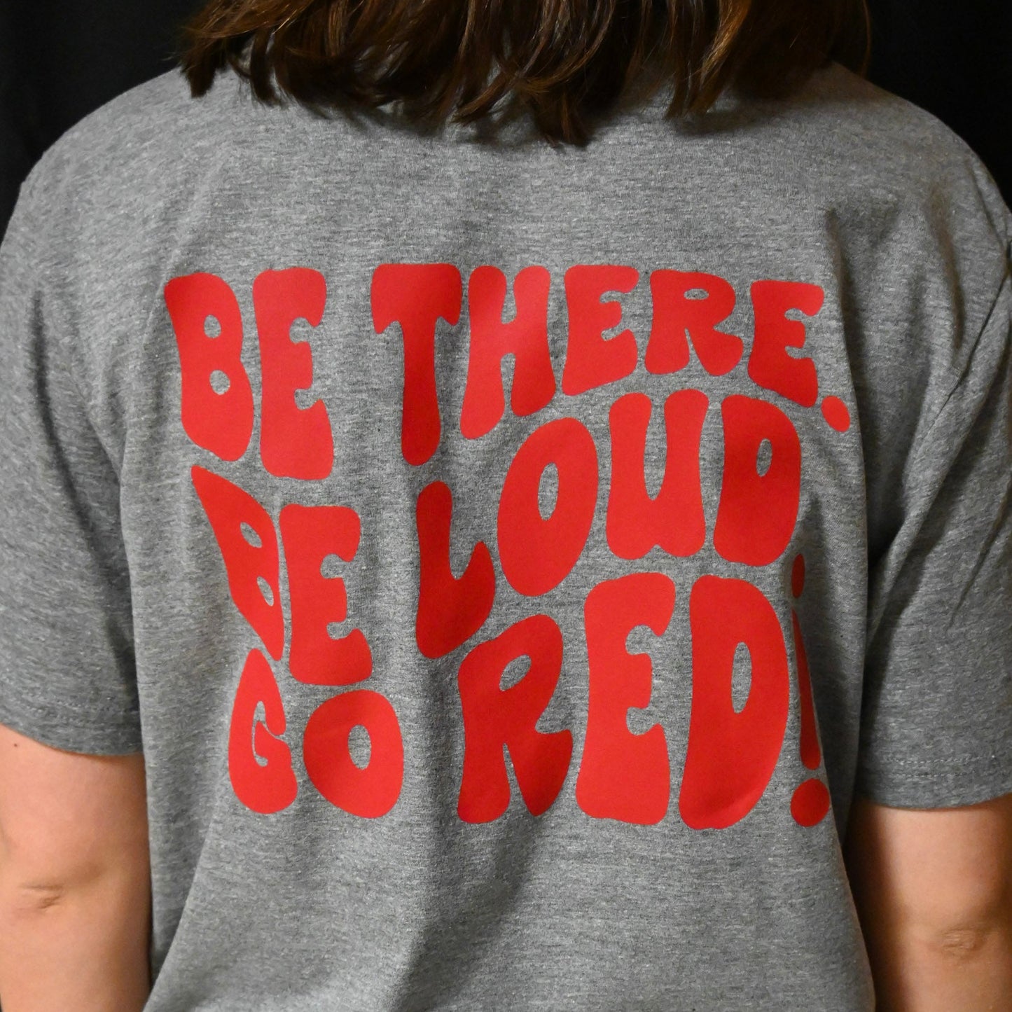 Pocket sentinel helmet on front with "BE THERE BE LOUD GO RED! " on back T-shirt