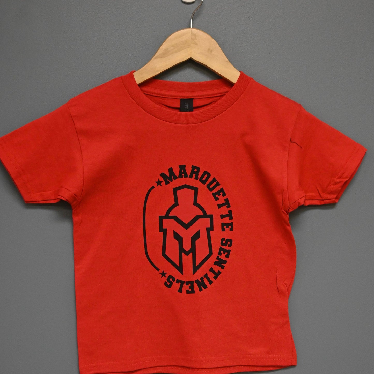 Short Sleeve red shirt with Marquette Sentinels "helmet and Stars" design
