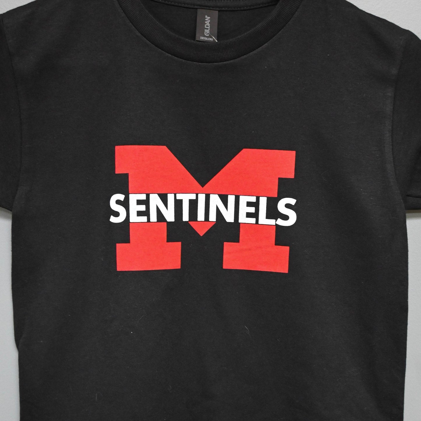 Black short sleeve with red and white Sentinels "M"